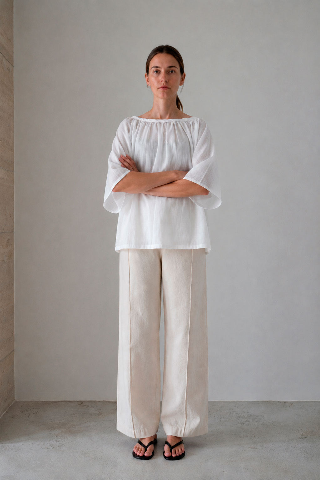 Valenza blouse in white, full-length front view with arms crossed