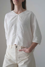 Marei blouse in white, three-quarter front view
