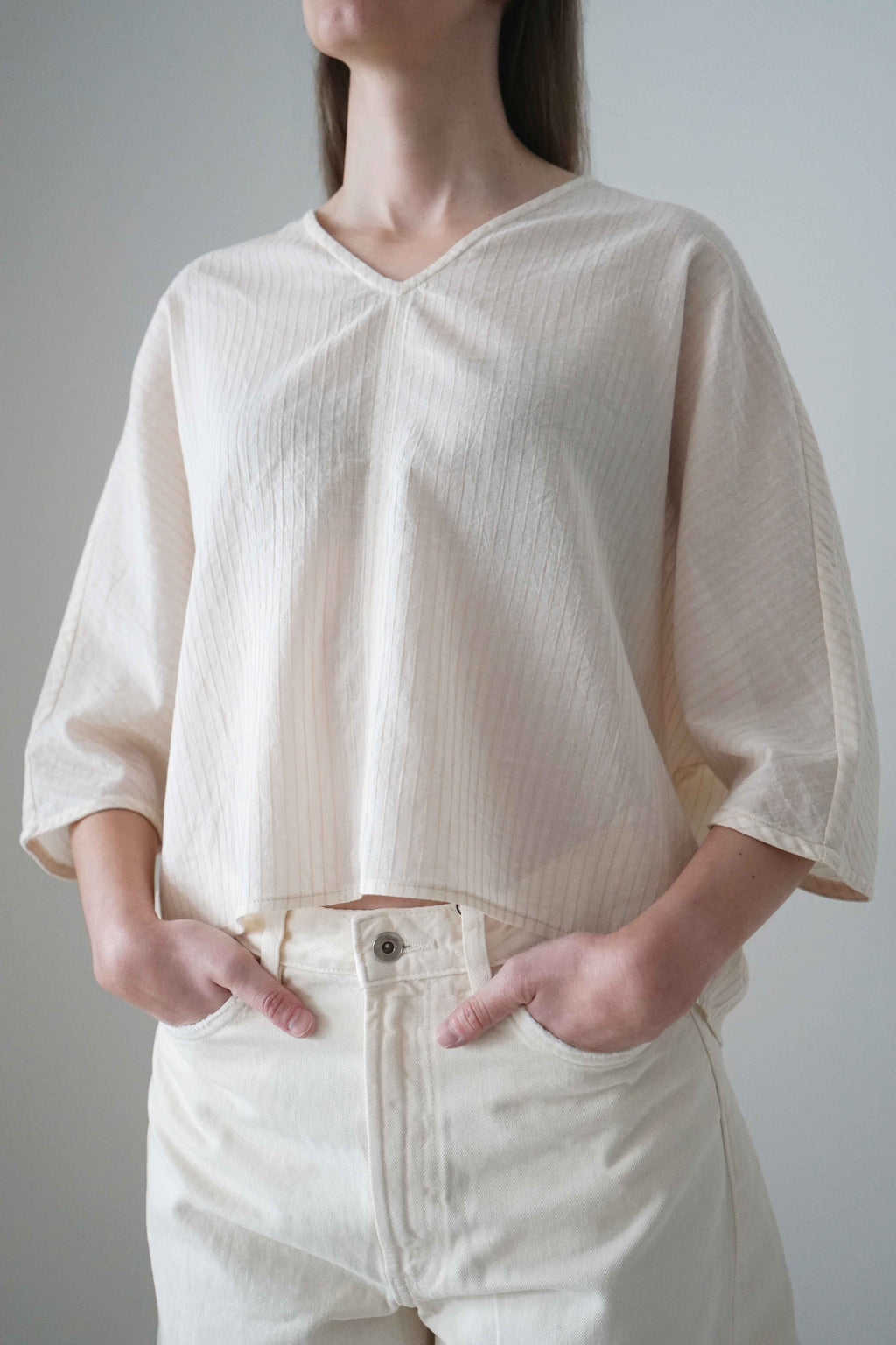 Marei blouse in beige, three-quarter front view