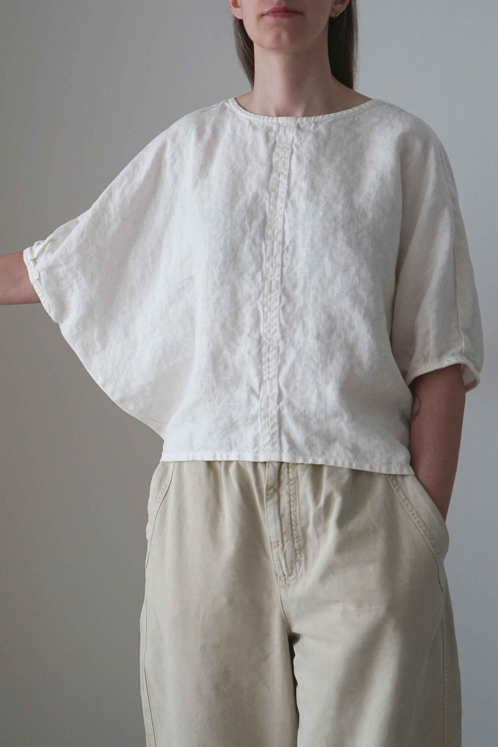 Emes blouse in white, front view showing the batwing sleeve