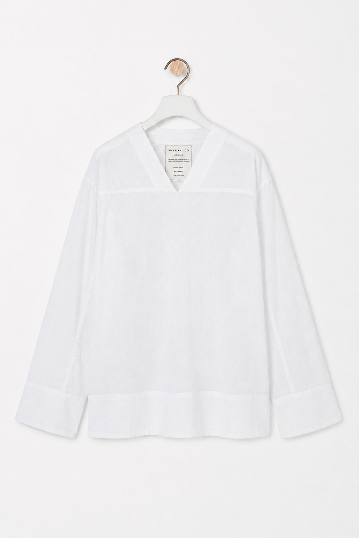 Laxe shirt in white, hanging, front view