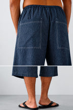 Lois trousers in navy stripes, back view with patch pockets
